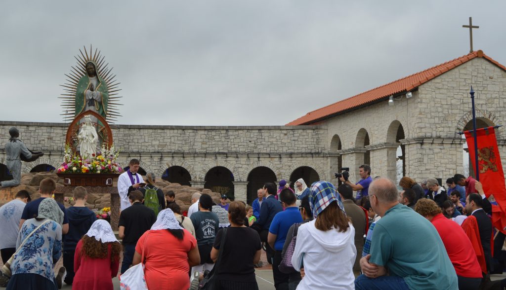 Penitent Catholics recieve a blessing from Fr. John Kodet